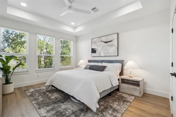 a bedroom with a large bed and a window