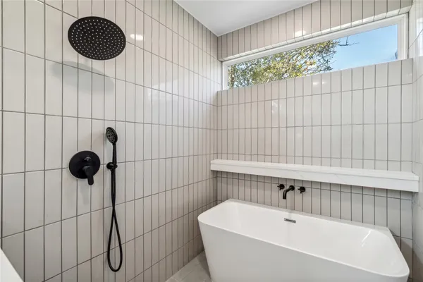 a bathroom with a sink and a shower