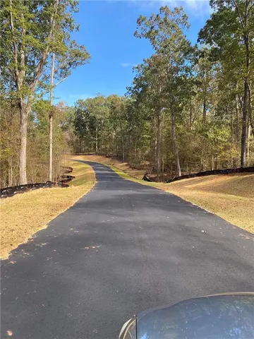 a view of a swimming pool with an outdoor space and seating area
