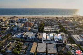 an aerial view of beach and city