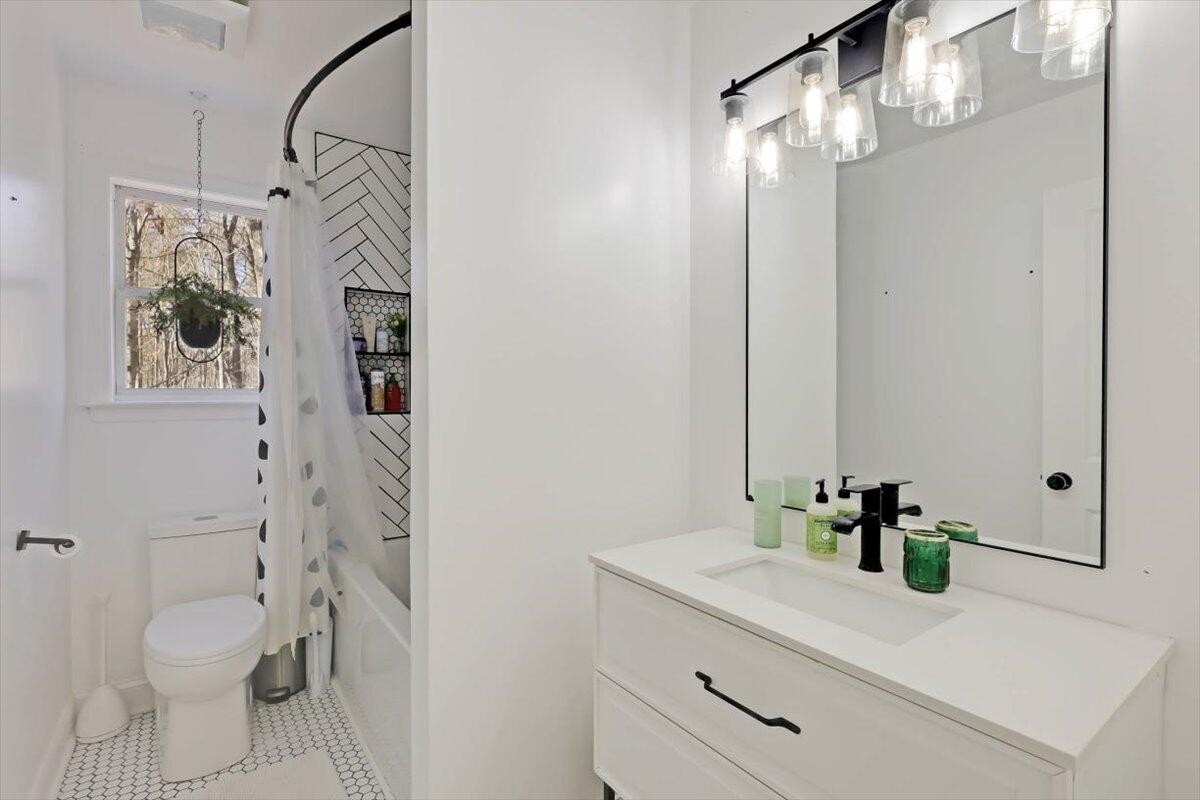2265 Little Bend Road Signal Mountain, TN 37377 - Photo 16 of 31 a bathroom with a sink a toilet and shower