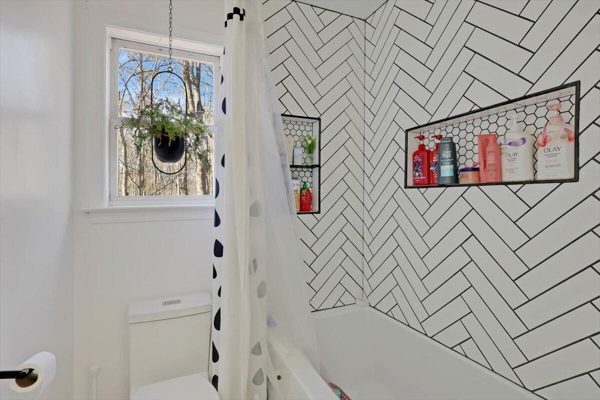 2265 Little Bend Road Signal Mountain, TN 37377 - Photo 17 of 31 a bathroom with a bathtub and a shower