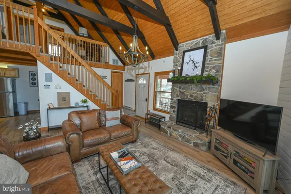 a view of living room with furniture and a rug