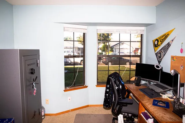 a workspace with furniture and a window