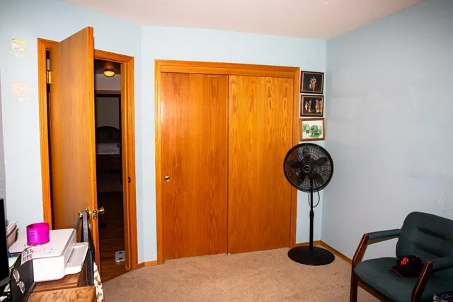 a room with a couch and chandelier