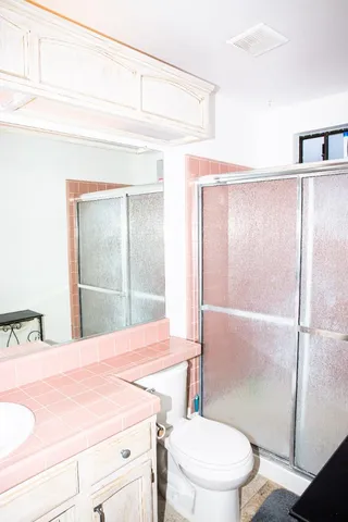 a bathroom with a sink and toilet