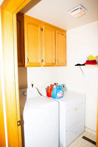 a bathroom with a sink and a bed