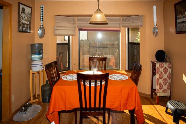 a dining room with furniture and window