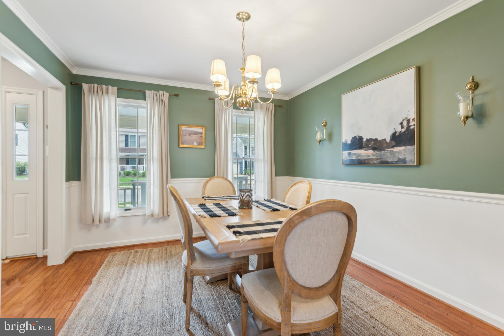 306 Saddle Ridge Road Annapolis, MD 21403 - Photo 20 of 44 a dining room with furniture a chandelier and wooden floor