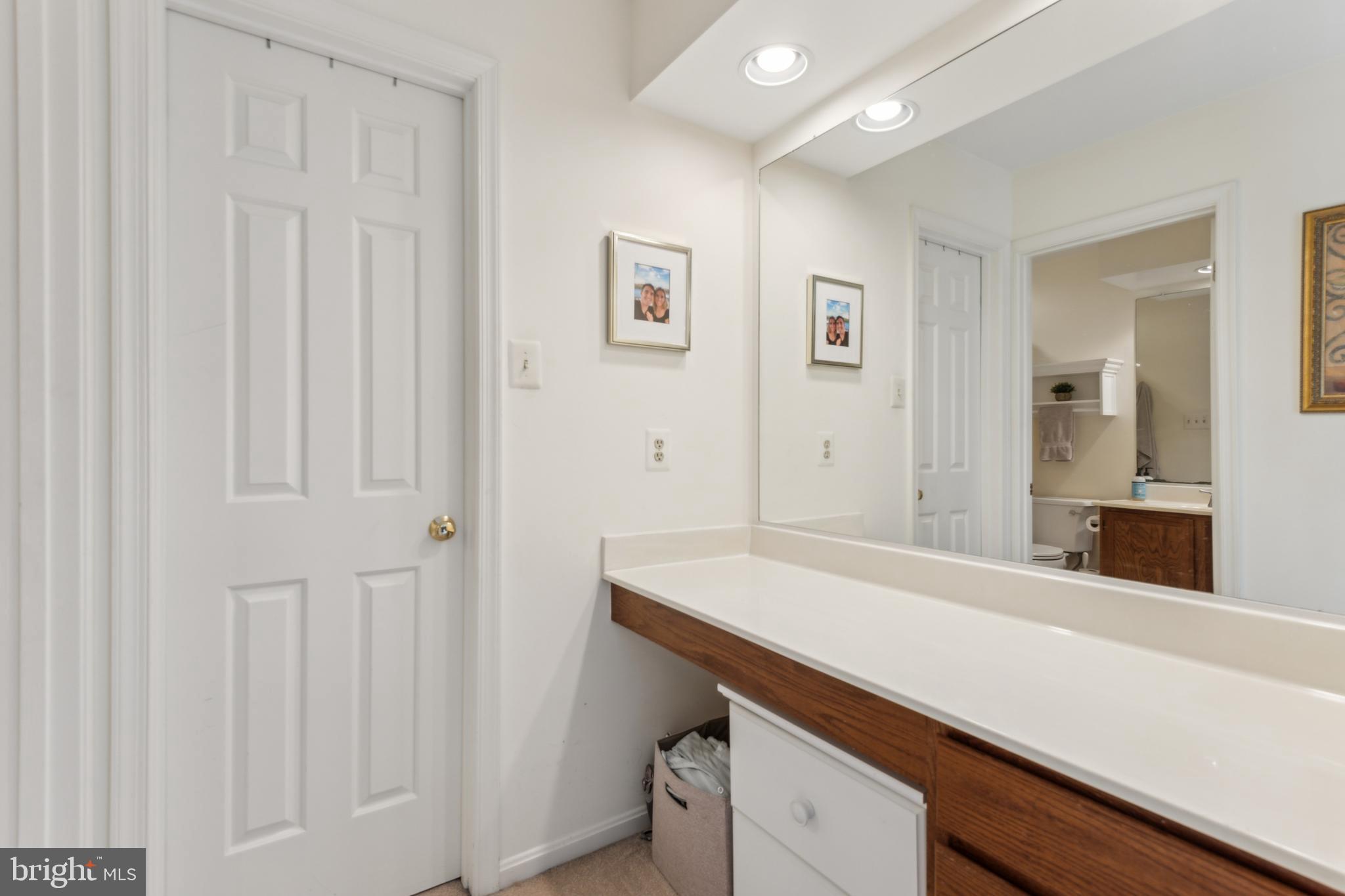 306 Saddle Ridge Road Annapolis, MD 21403 - Photo 23 of 44 a bathroom with a sink and a mirror