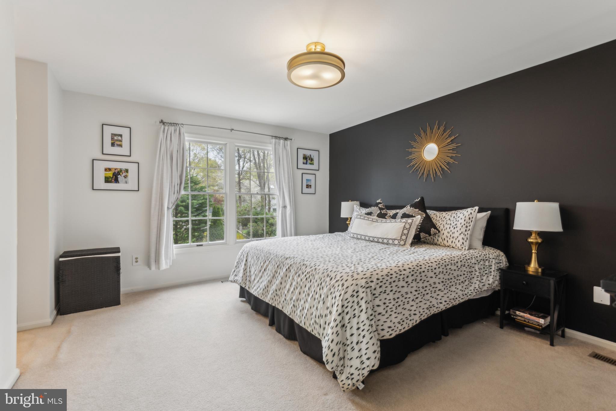 306 Saddle Ridge Road Annapolis, MD 21403 - Photo 25 of 44 a bed sitting in a bedroom next to a window