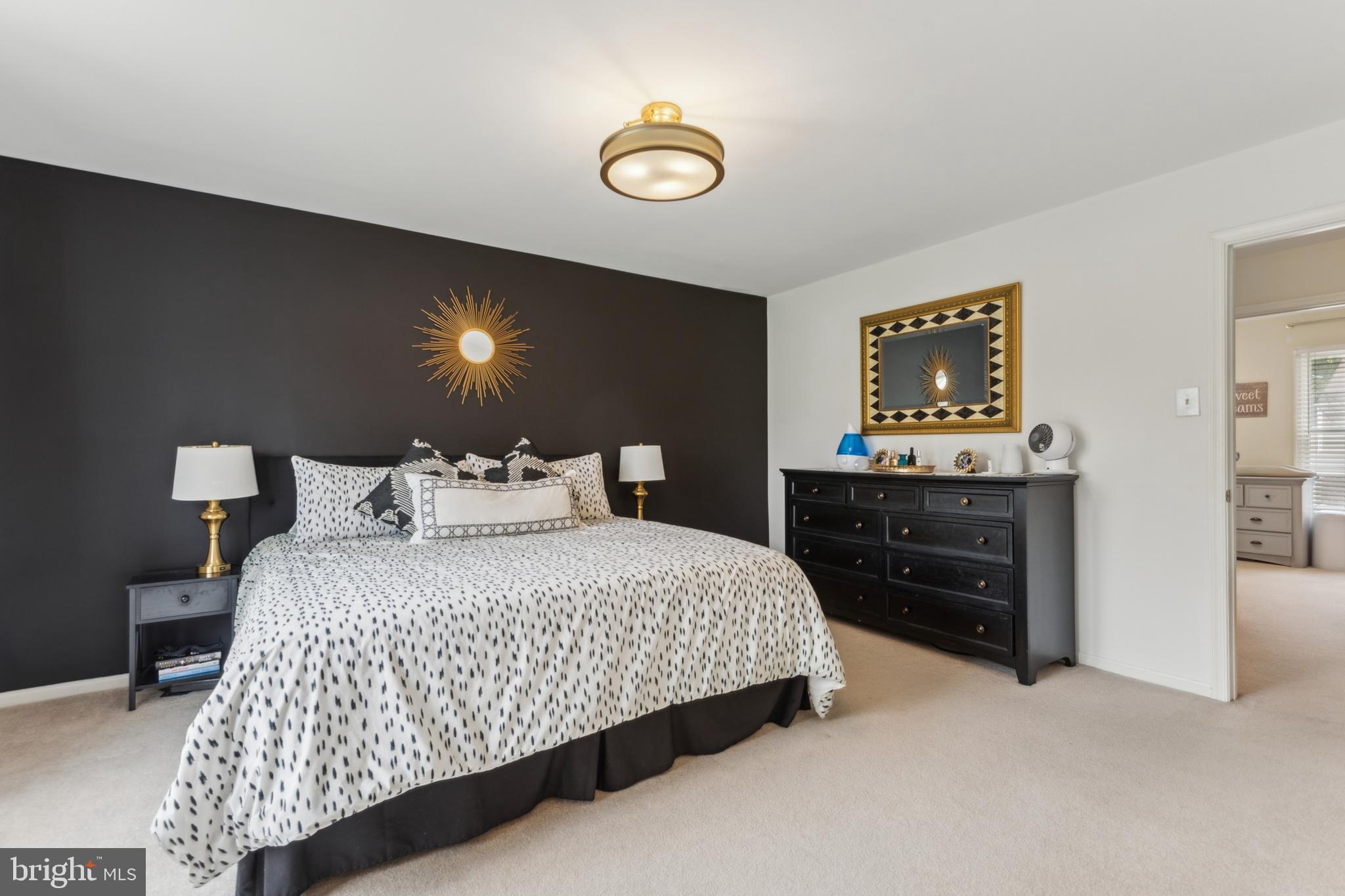 306 Saddle Ridge Road Annapolis, MD 21403 - Photo 26 of 44 a bedroom with a bed and a lamp on dresser
