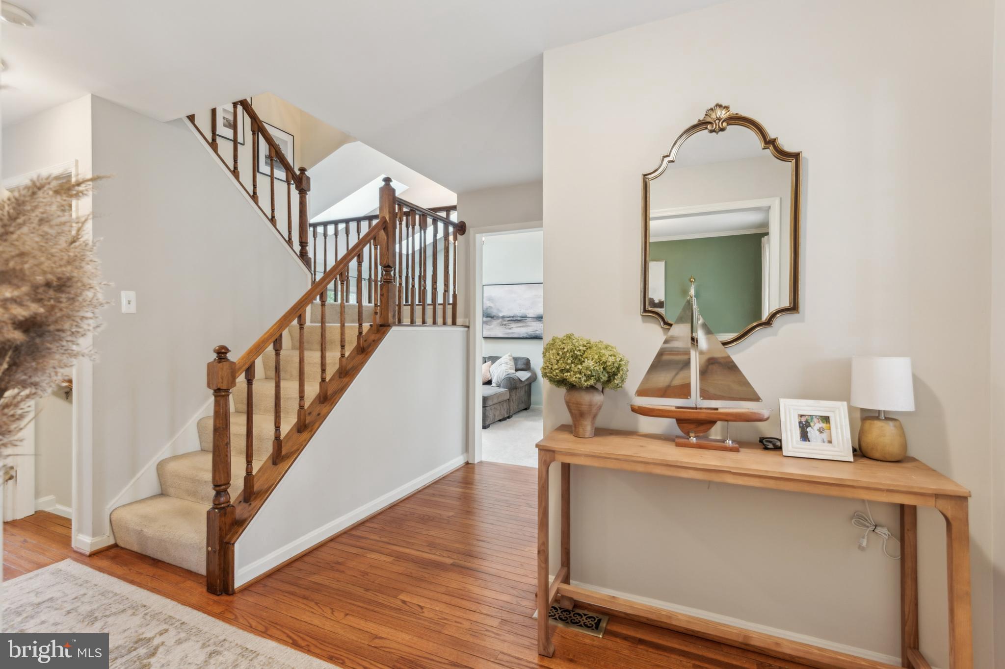 306 Saddle Ridge Road Annapolis, MD 21403 - Photo 5 of 44 a living room with stairs and a wooden floor