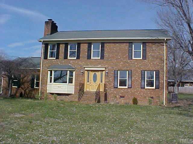 1914 Umstead Road Durham, NC 27712 - Photo 1 of 1 a front view of a house with a yard