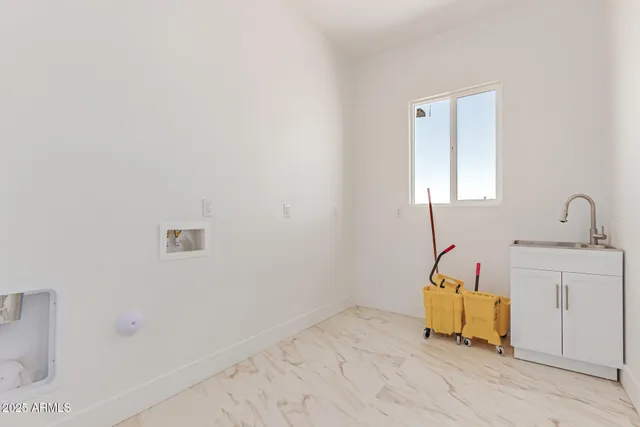 a bathroom with a sink and mirror