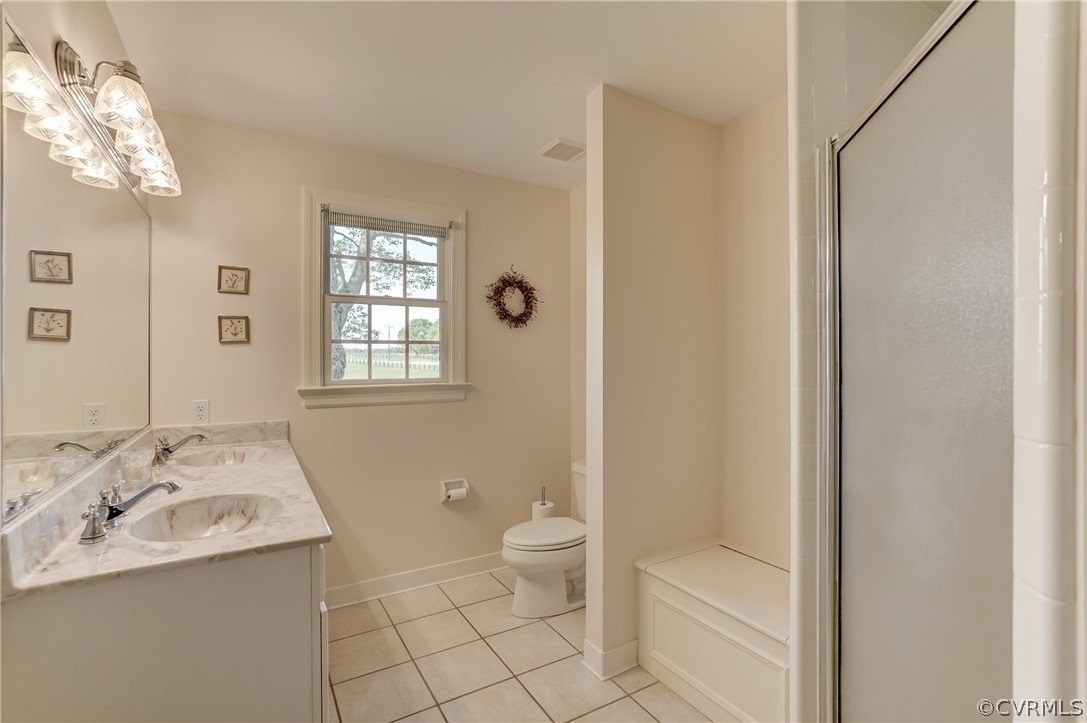 1607 Genito Road Crozier, VA 23039 - Photo 17 of 49 a bathroom with a sink a toilet and shower
