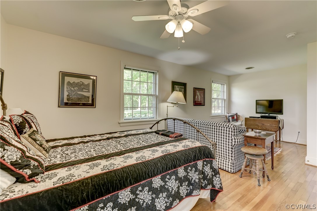 1607 Genito Road Crozier, VA 23039 - Photo 23 of 49 a bedroom with a bed and wooden floor