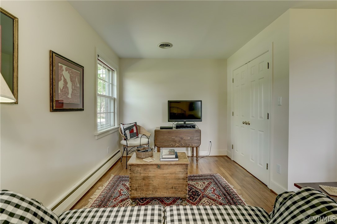 1607 Genito Road Crozier, VA 23039 - Photo 24 of 49 a living room with furniture and a flat screen tv