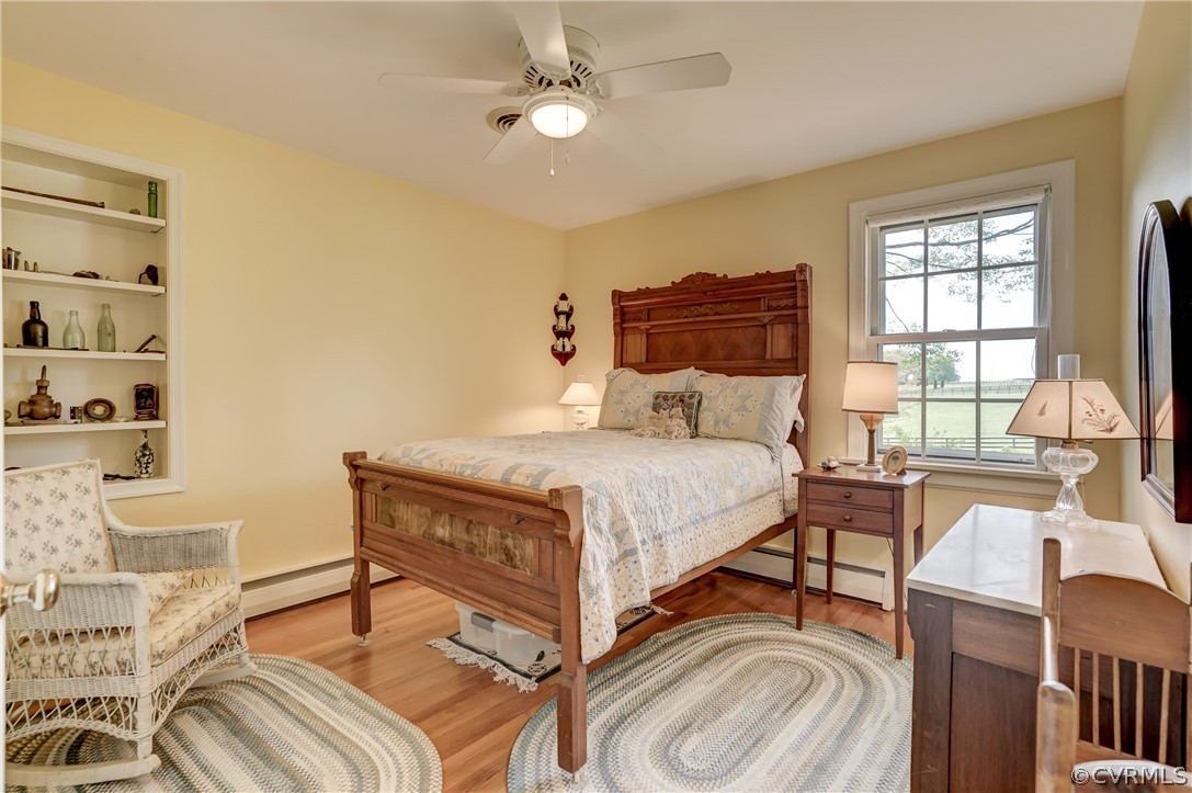 1607 Genito Road Crozier, VA 23039 - Photo 25 of 49 a bedroom with a bed and a table with chair