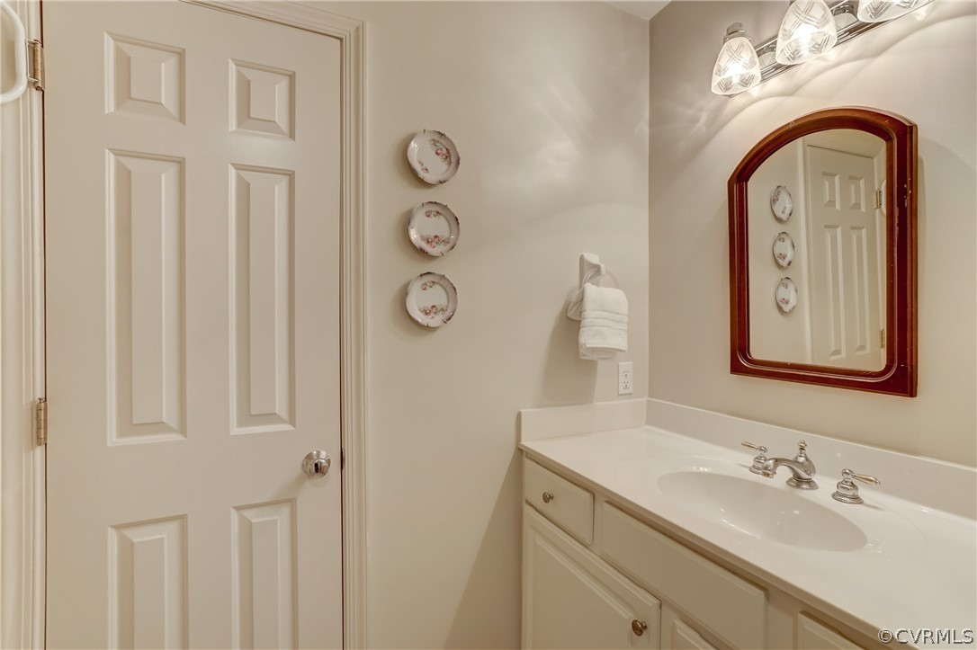 1607 Genito Road Crozier, VA 23039 - Photo 26 of 49 a bathroom with a sink and a mirror