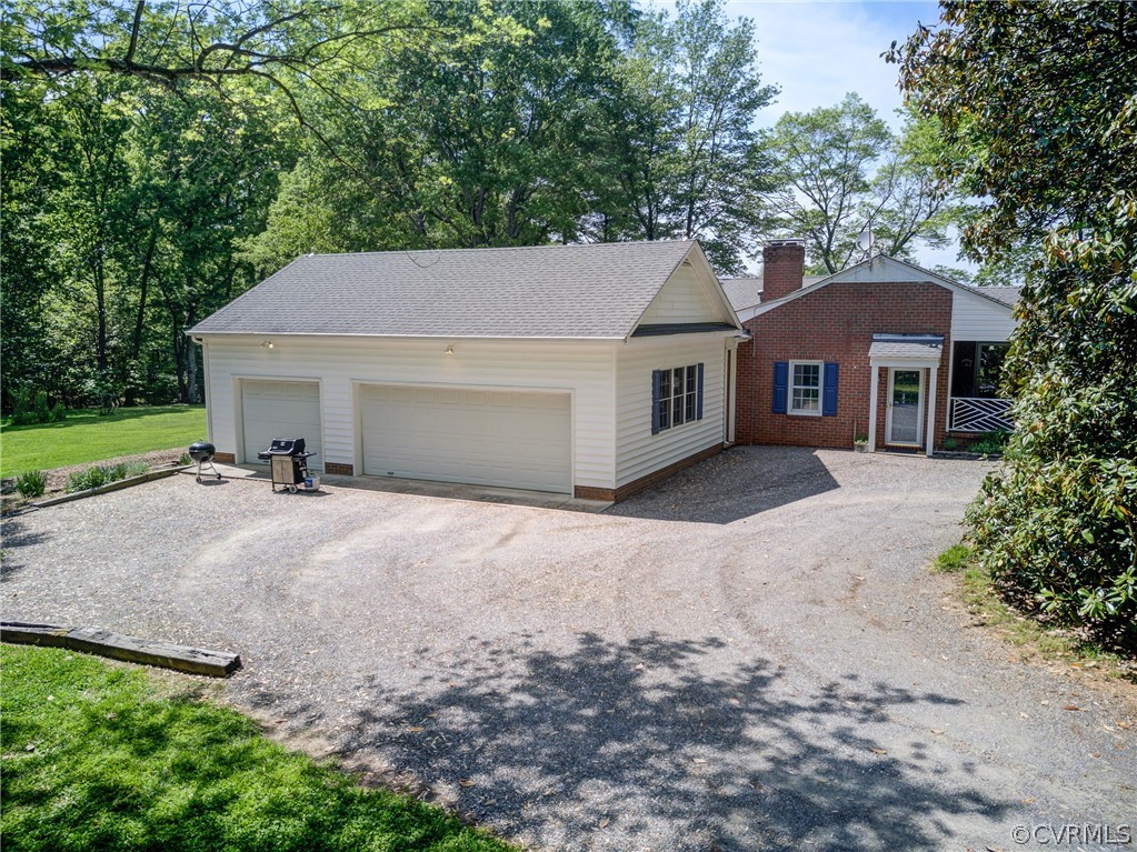 1607 Genito Road Crozier, VA 23039 - Photo 35 of 49 a view of a house with a yard and large tree