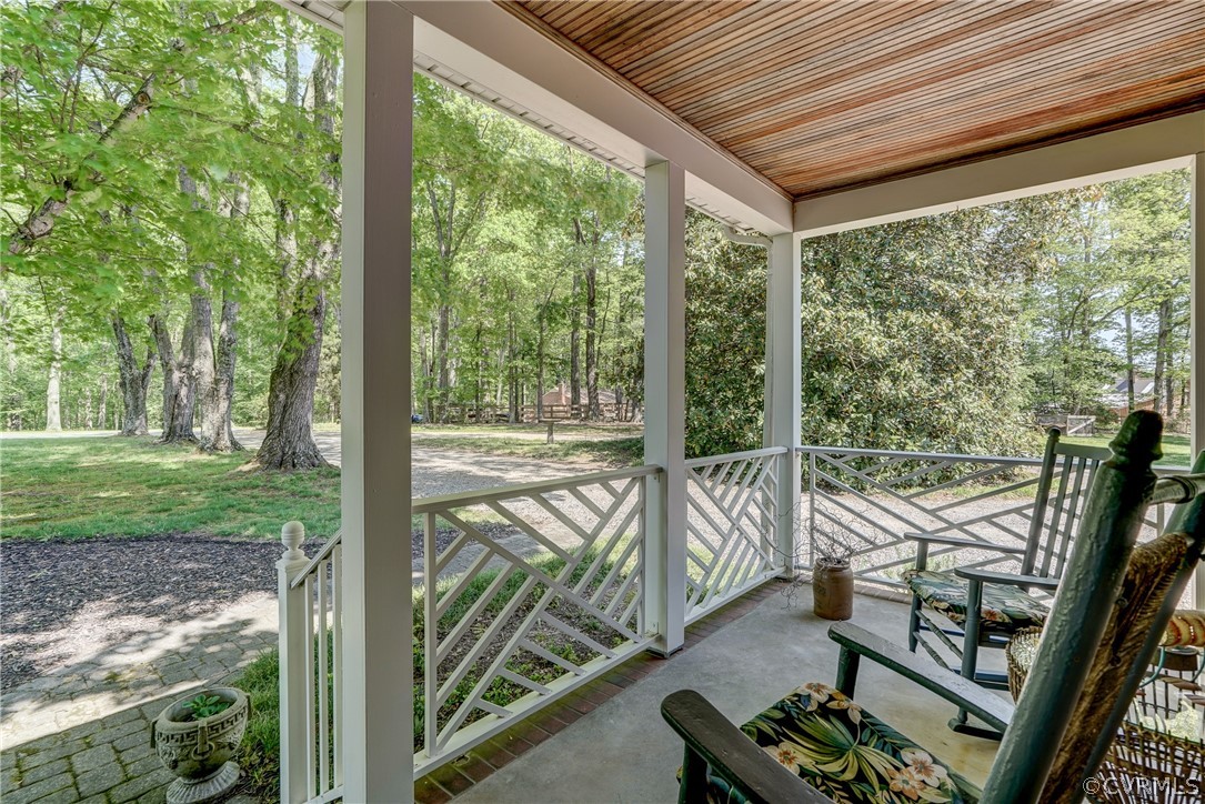 1607 Genito Road Crozier, VA 23039 - Photo 37 of 49 a view of a porch with furniture and garden