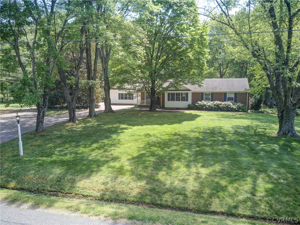 1607 Genito Road Crozier, VA 23039 - Photo 47 of 49 a view of a house with a yard