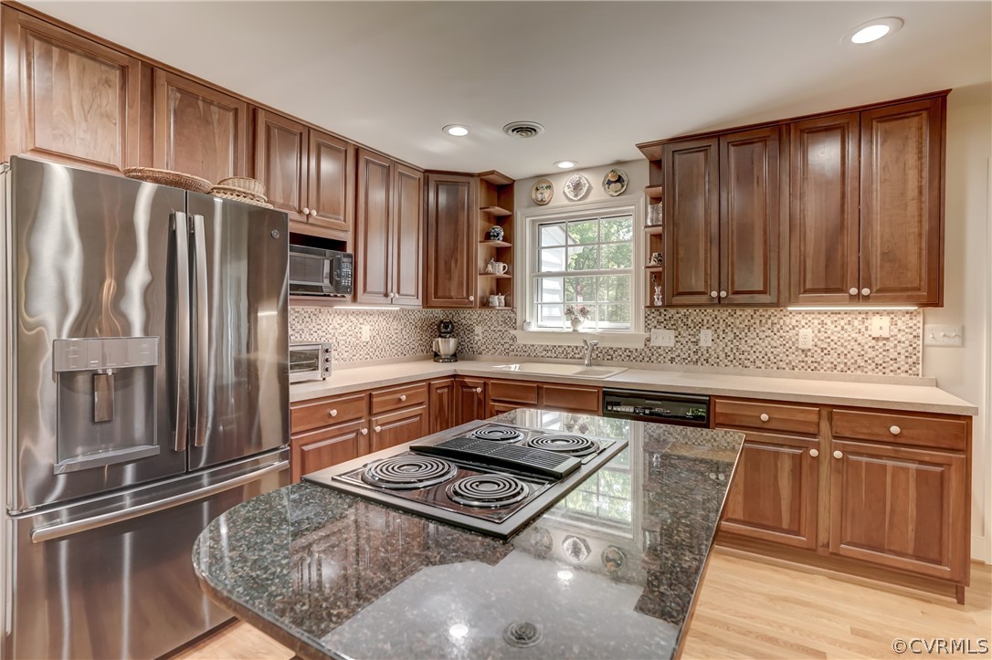1607 Genito Road Crozier, VA 23039 - Photo 7 of 49 a kitchen with granite countertop a refrigerator stove and sink