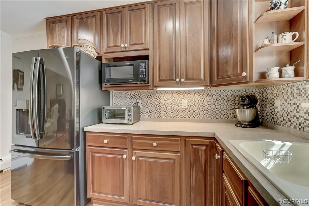1607 Genito Road Crozier, VA 23039 - Photo 10 of 49 a kitchen with granite countertop stainless steel appliances and cabinets