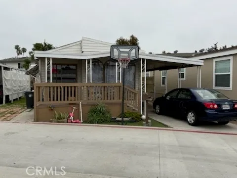 a view of a car park in front of house