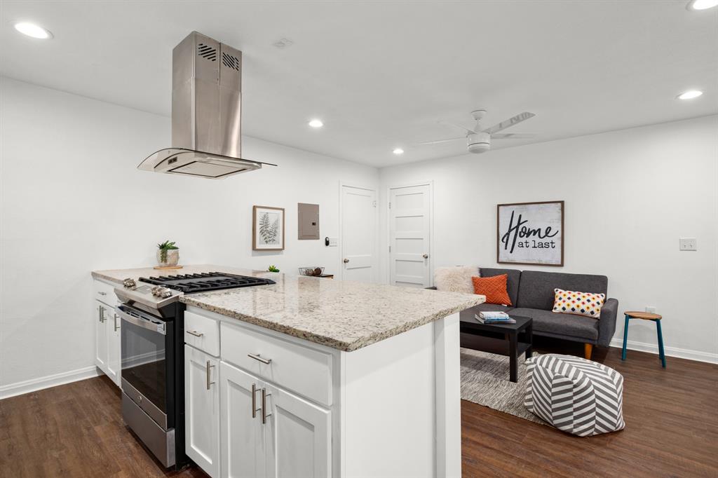 301 East 33rd Street, Unit 3 Austin, TX 78705 - Photo 6 of 13 a living room with furniture and kitchen view