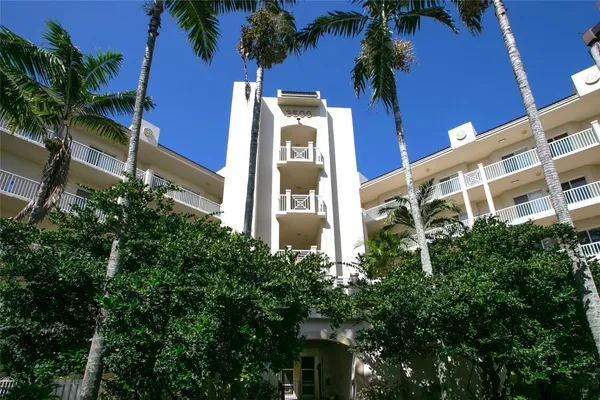 a view of a building with a tree