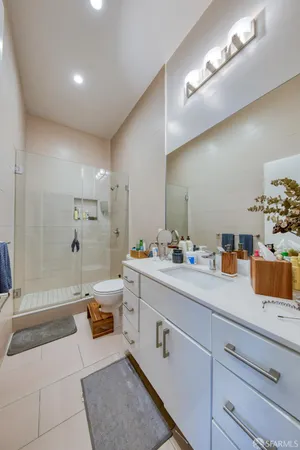 a bathroom with a tub sink and mirror