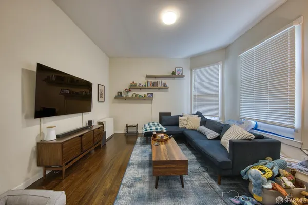 a living room with furniture and a flat screen tv