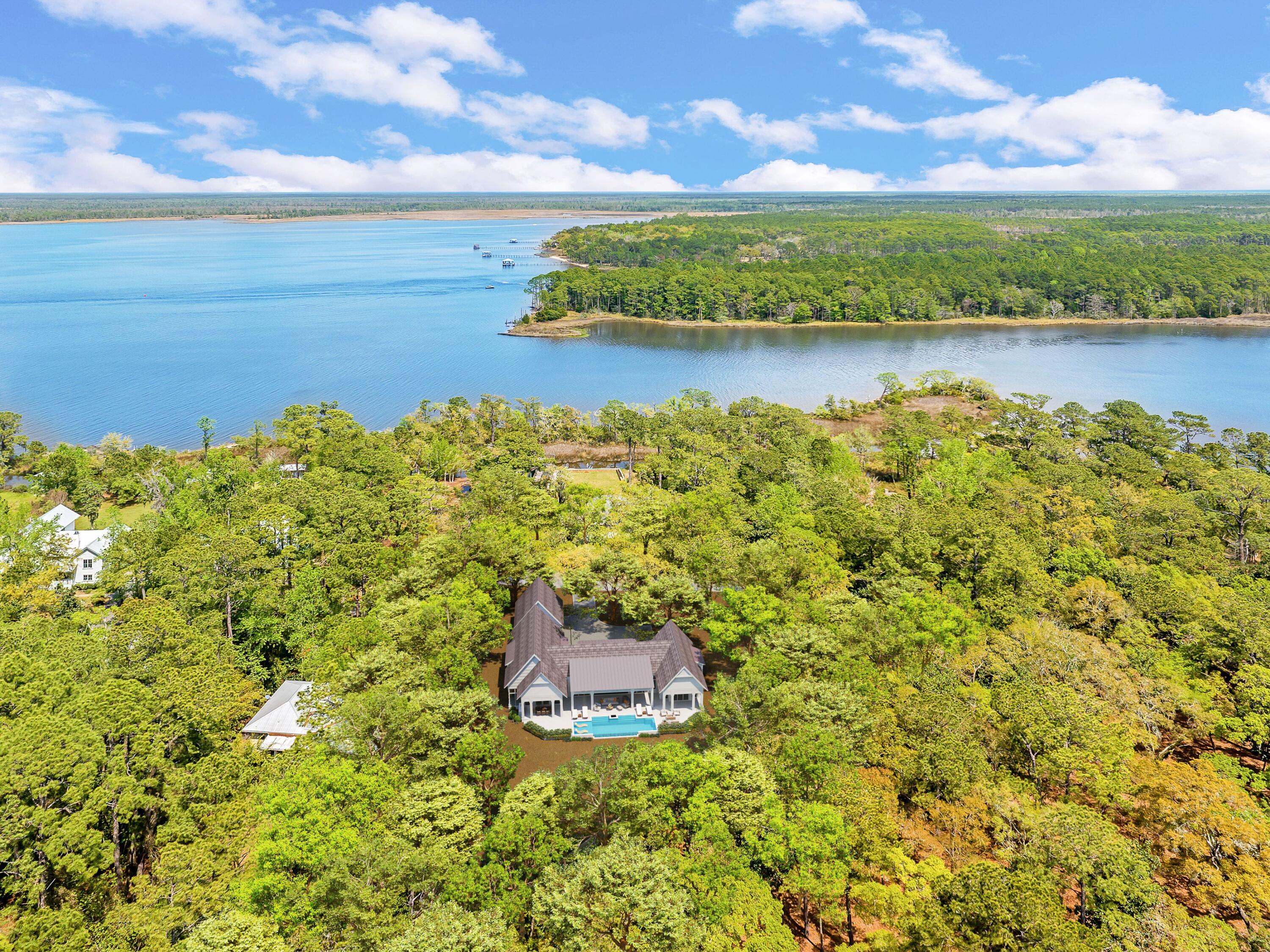 Lot 9 East Shallows Drive Santa Rosa Beach, FL 32459 - Photo 7 of 13 a view of a lake with a big yard