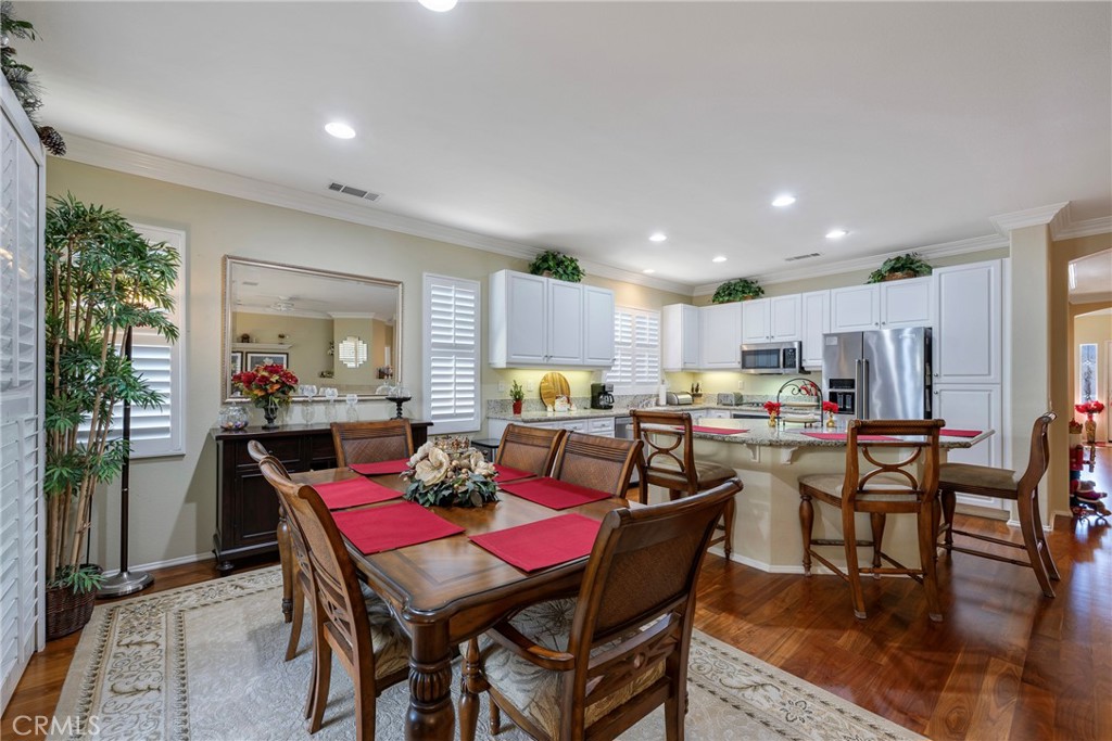 27956 Crystal Spring Drive Menifee, CA 92584 - Photo 19 of 75 a view of a dining room with furniture