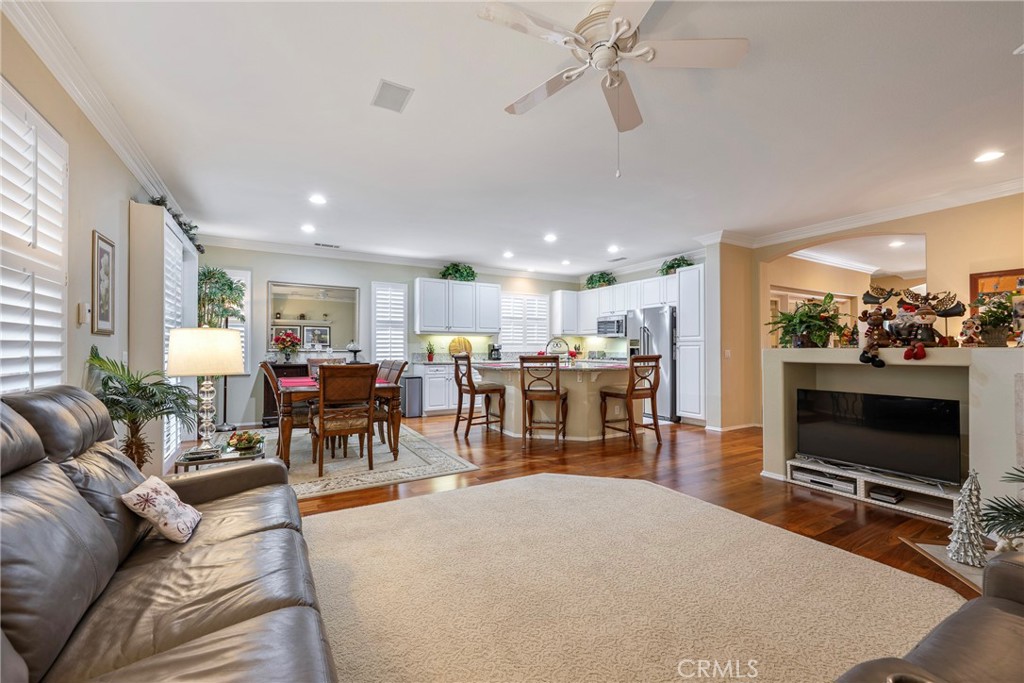 27956 Crystal Spring Drive Menifee, CA 92584 - Photo 30 of 75 a living room with furniture and a flat screen tv