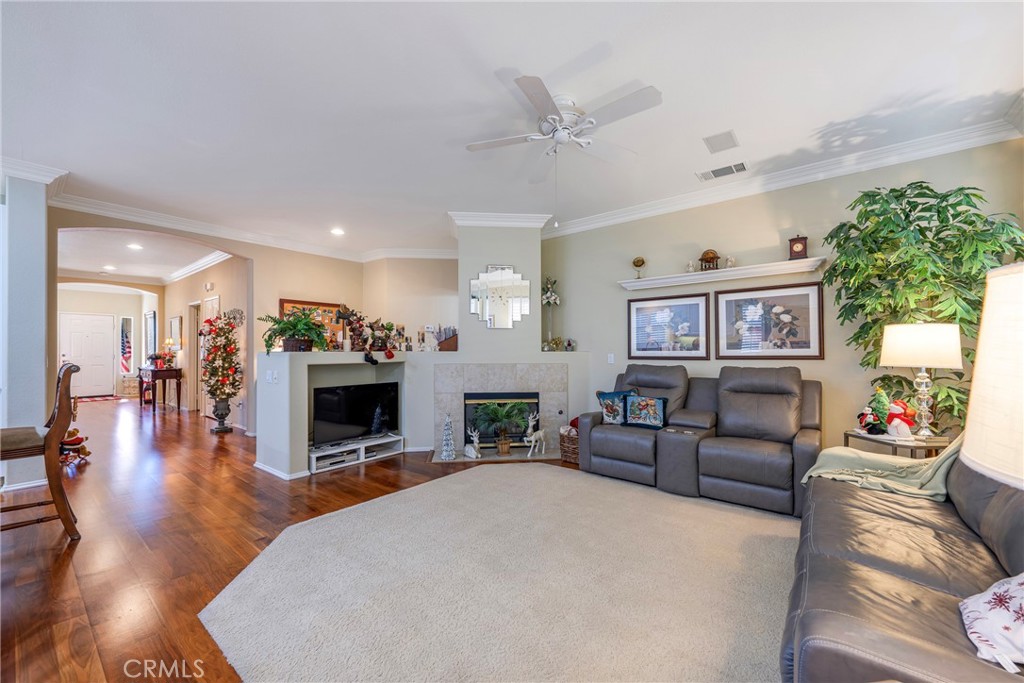 27956 Crystal Spring Drive Menifee, CA 92584 - Photo 32 of 75 a living room with furniture and a fireplace