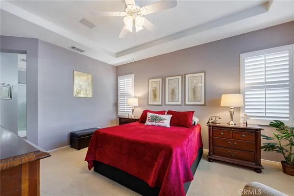 a bedroom with a bed and a desk
