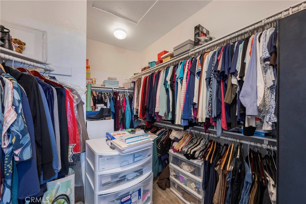 27956 Crystal Spring Drive Menifee, CA 92584 - Photo 39 of 75 a view of walk in closet with clothes