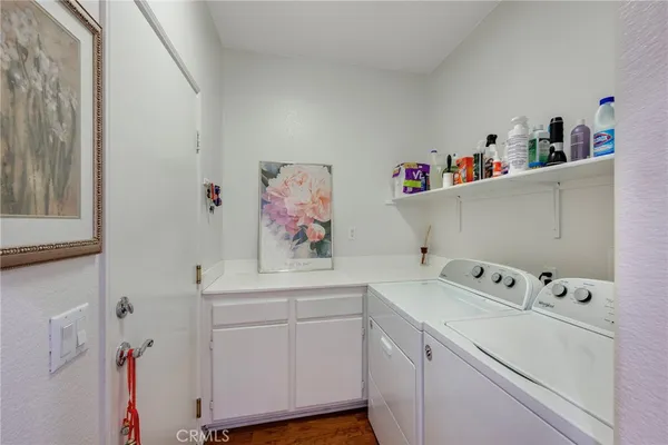a picture of a room with a white wall and a large window