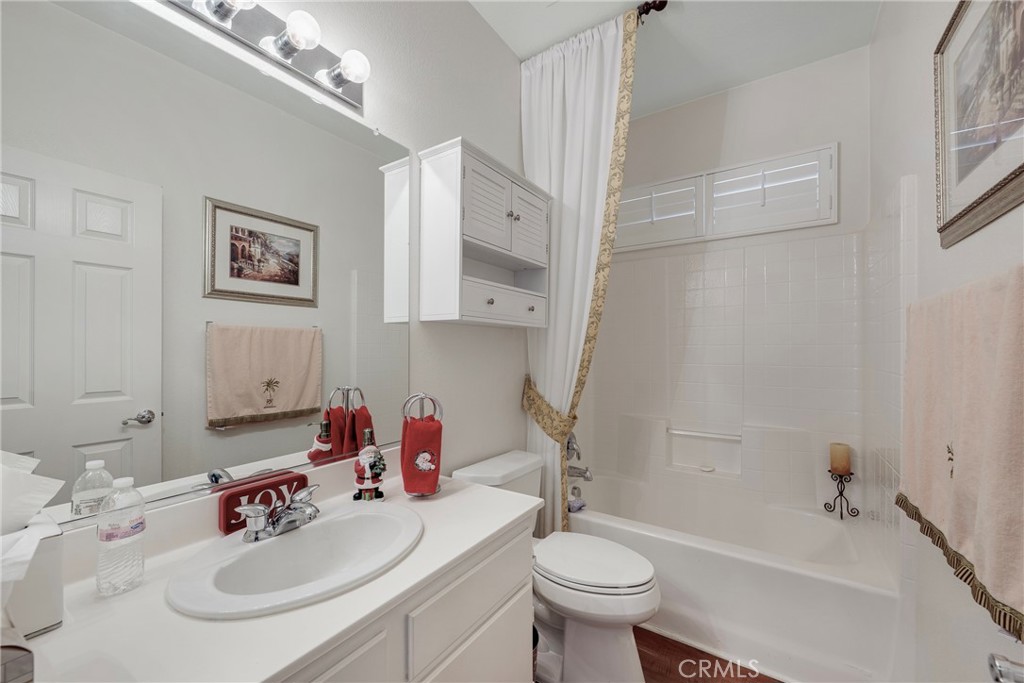 27956 Crystal Spring Drive Menifee, CA 92584 - Photo 52 of 75 a bathroom with a sink a toilet and shower