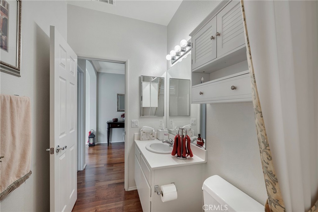 27956 Crystal Spring Drive Menifee, CA 92584 - Photo 53 of 75 a bathroom with a sink vanity mirror and toilet