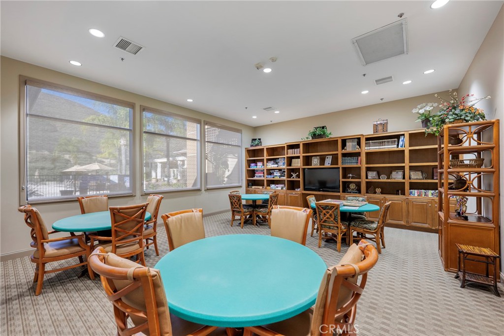 27956 Crystal Spring Drive Menifee, CA 92584 - Photo 58 of 75 a view of a dining room with furniture window and wooden floor