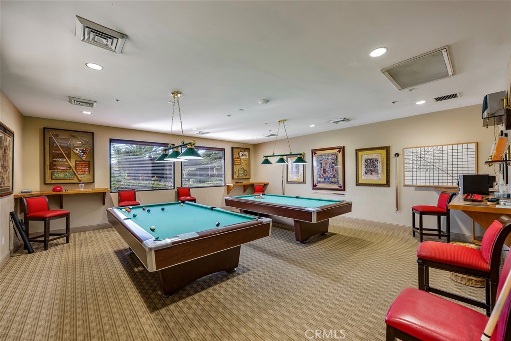 27956 Crystal Spring Drive Menifee, CA 92584 - Photo 60 of 75 a living room with furniture a pool table and a flat screen tv