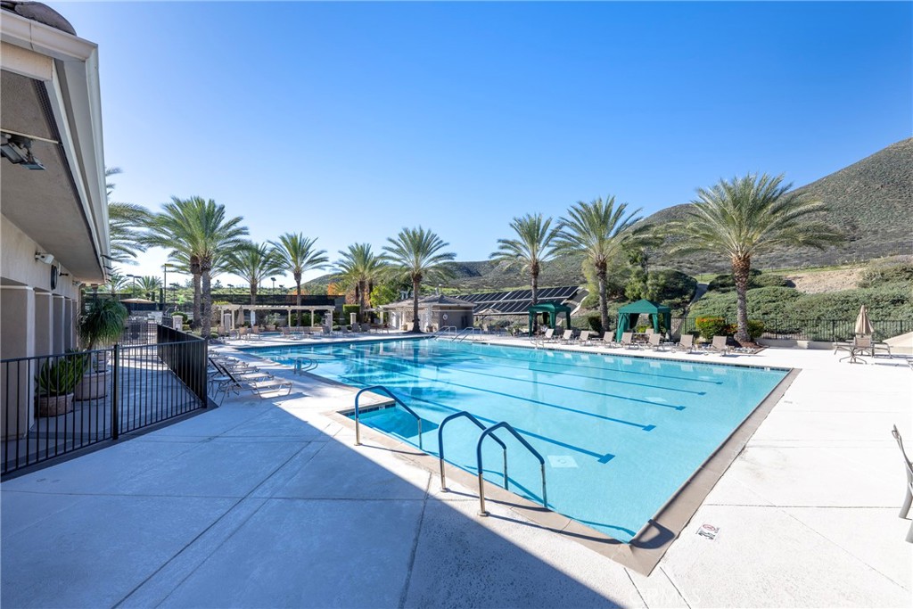27956 Crystal Spring Drive Menifee, CA 92584 - Photo 69 of 75 a view of swimming pool with outdoor seating and plants