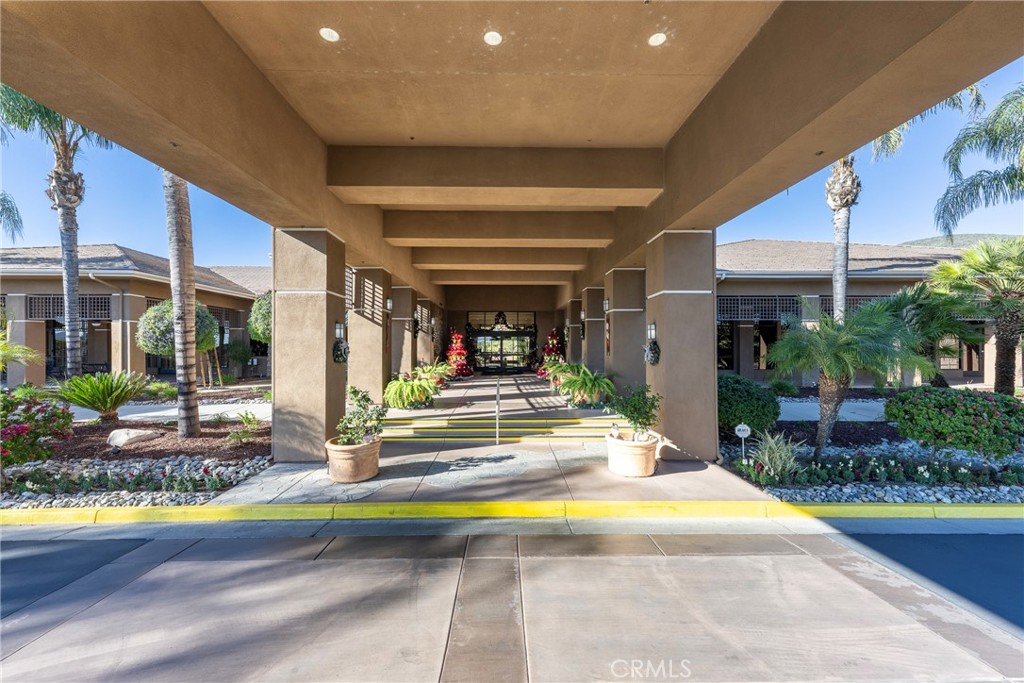 27956 Crystal Spring Drive Menifee, CA 92584 - Photo 73 of 75 a view of swimming pool with a lounge chairs in front of house