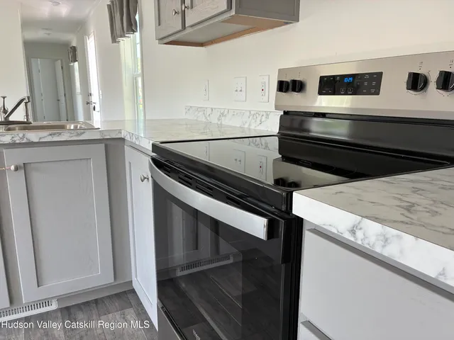 a kitchen with a stove and a microwave