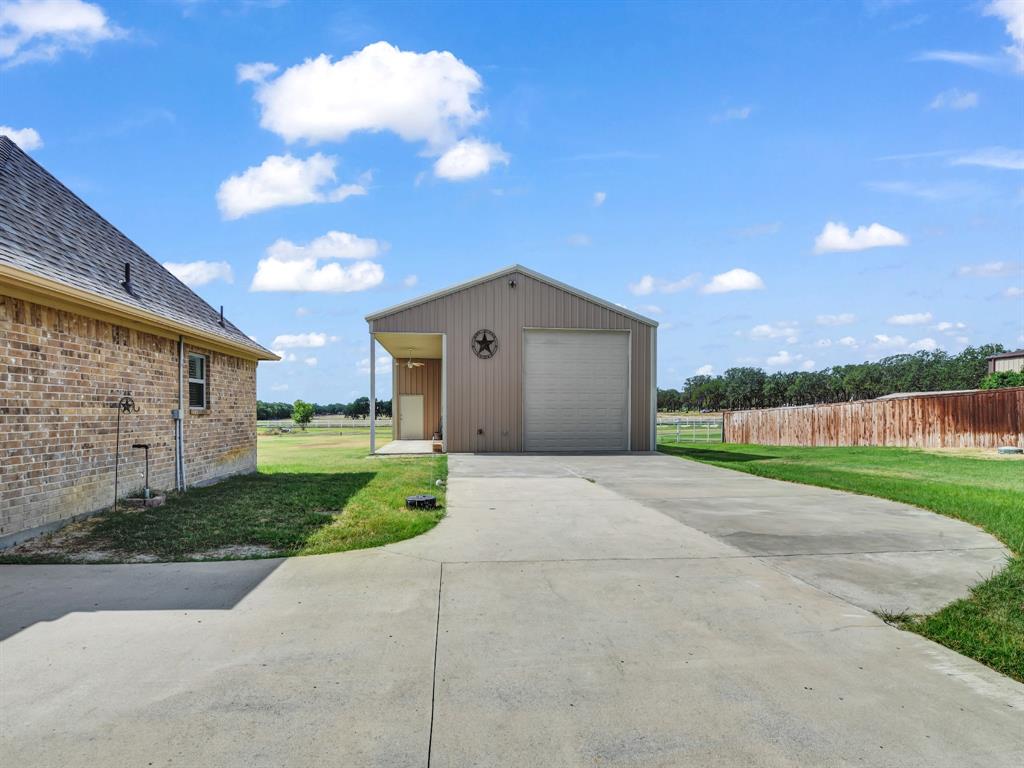 169 Pack Saddle Trail Weatherford, TX 76088 - Photo 11 of 40 a view of a house with a yard