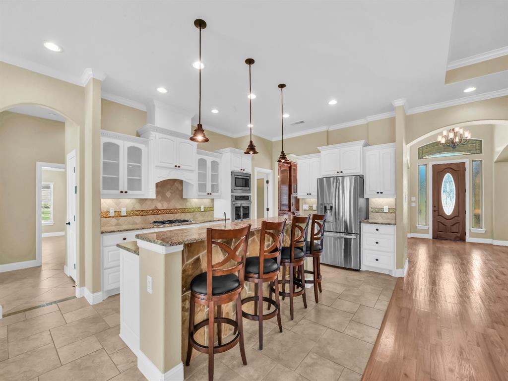 169 Pack Saddle Trail Weatherford, TX 76088 - Photo 15 of 40 a large kitchen with a table and chairs